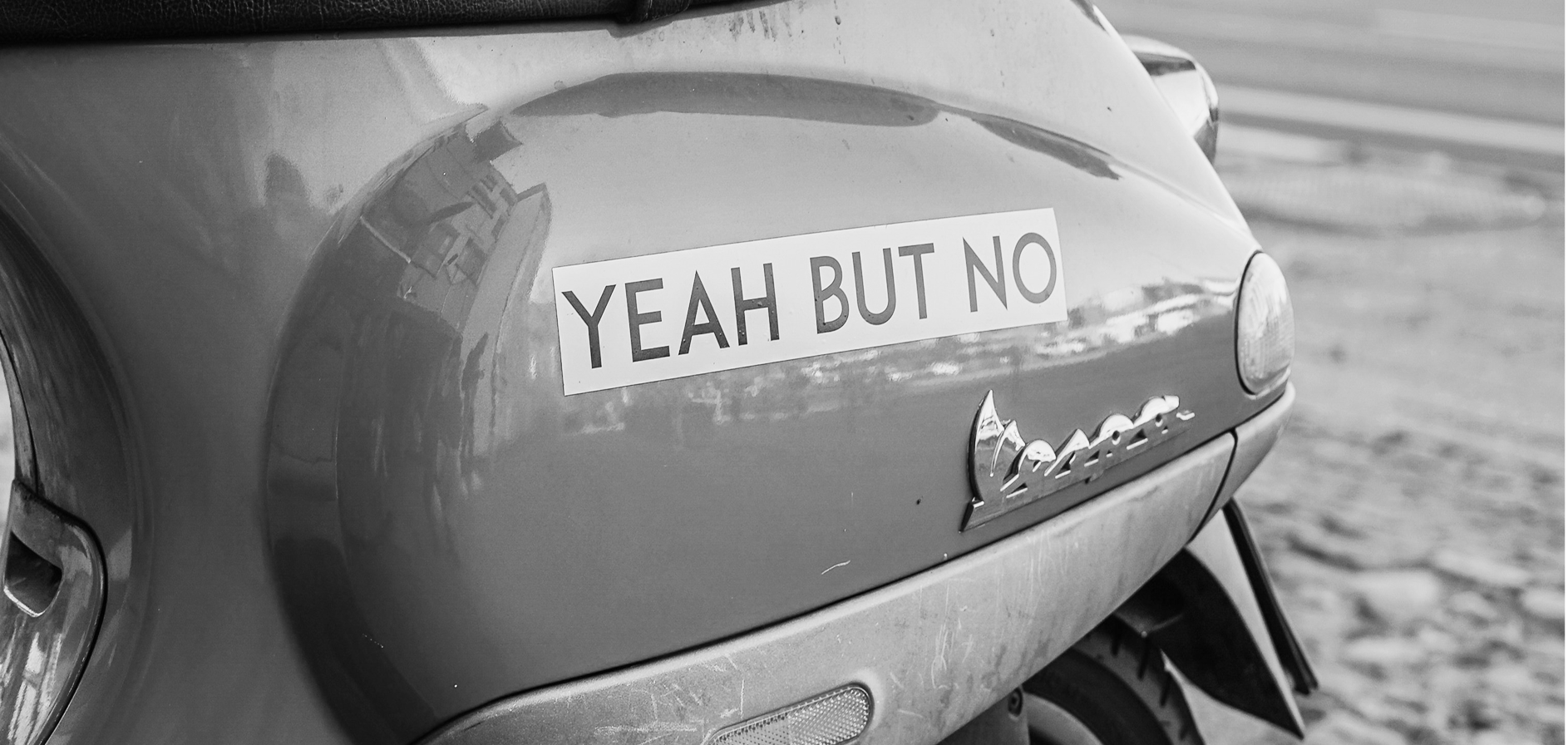 Vespa scooter with a sticker that says 'Yeah, but no'